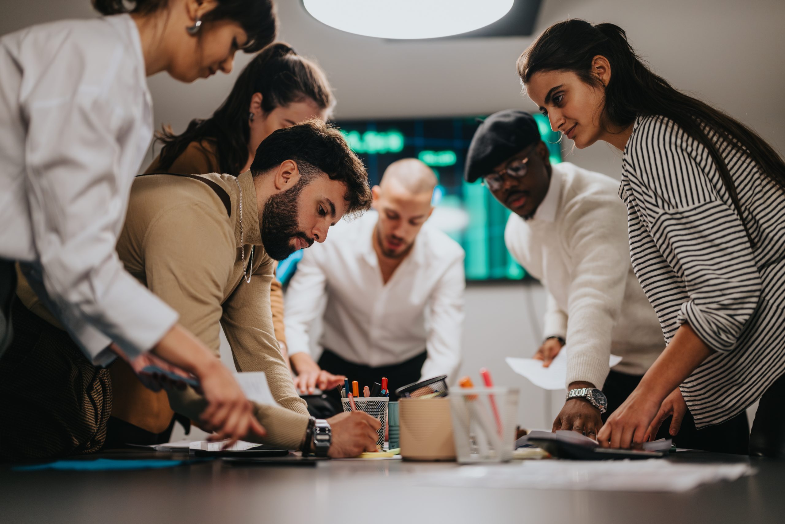 Rebel Spotlight: Christian Cotichini, a team collaborating in a room